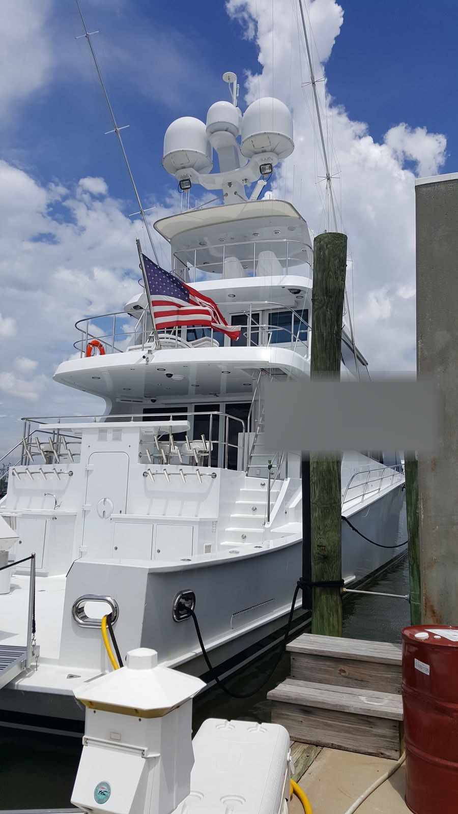 Yacht stern at the dock with shore power connected