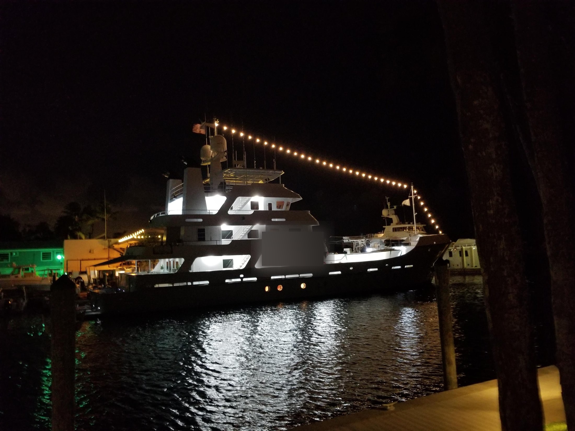 Luxury motor yacht illuminated at night in a New Orleans marina